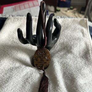 Brown Carved Pendant with Tassel